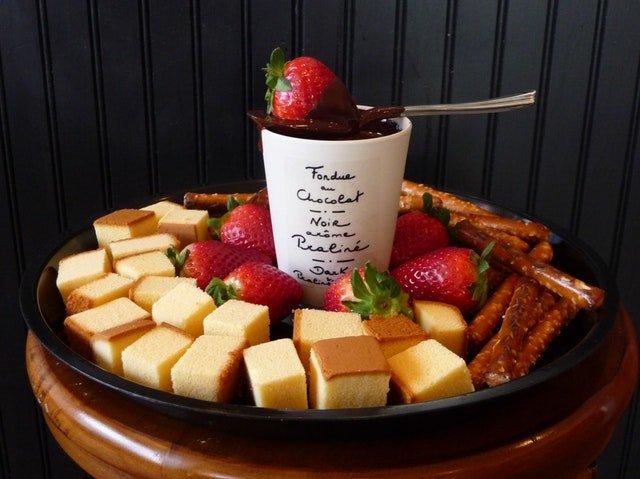 Chocolate-fondue-pot-with-strawberries-cake-and-nibbles