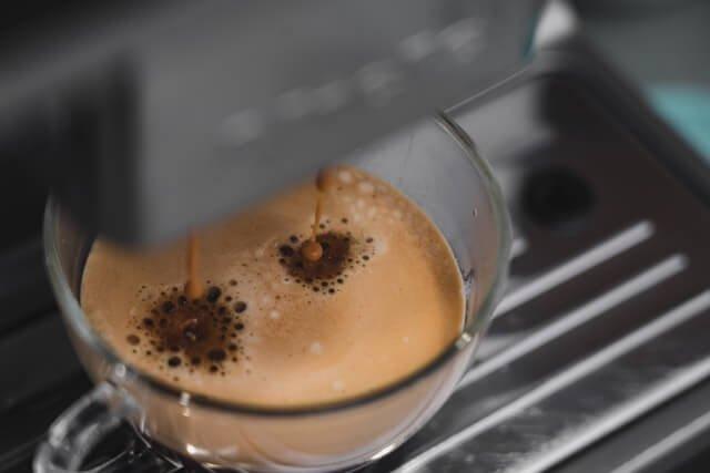 Close-up-espresso-machine-pouring-coffee