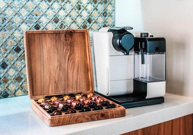 Coffee-pod-machine-and-box-of-coffee-capsules