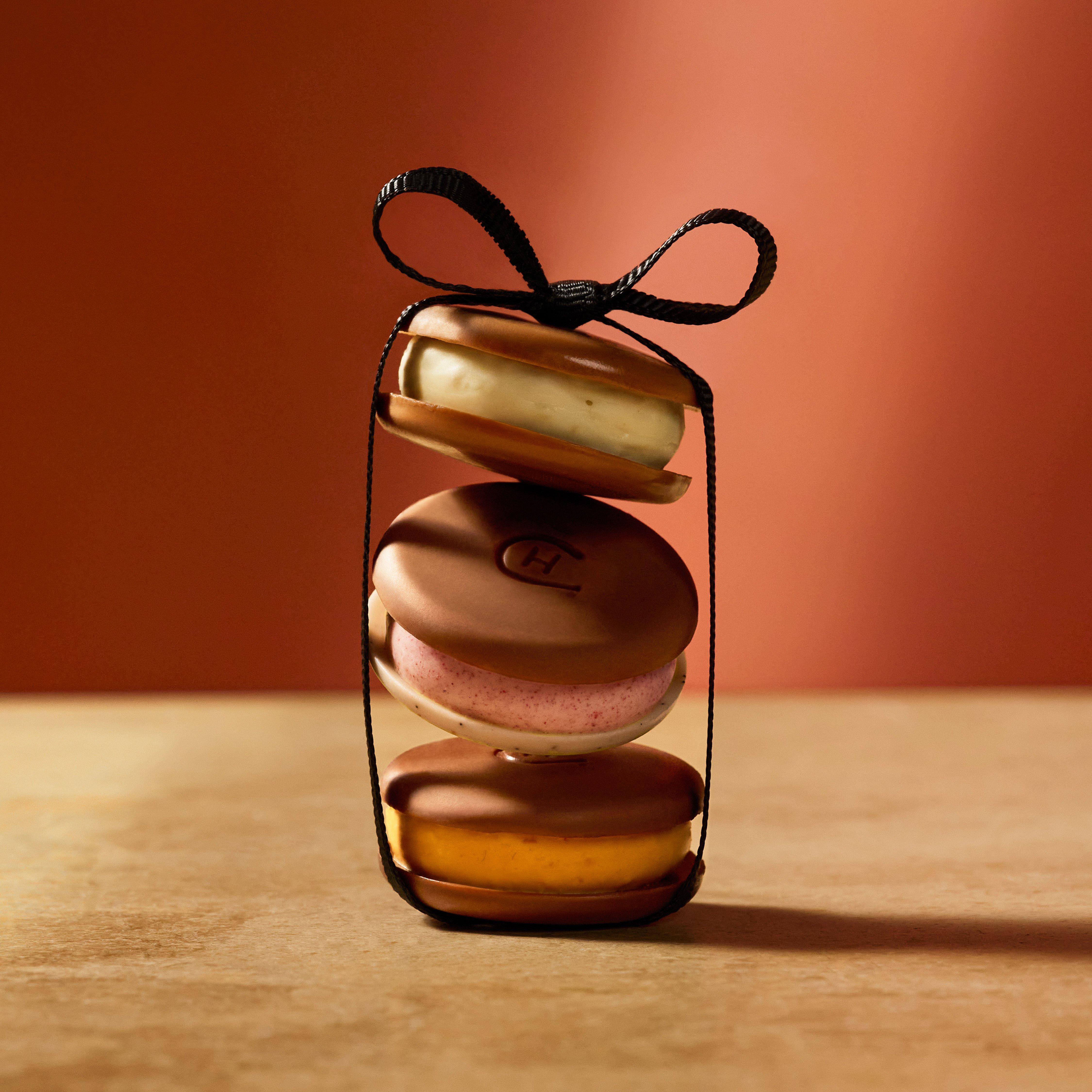 a close up of a dessert with chocolate, caramel and nuts