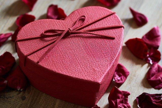 Red-heart-shaped-box-with-rose-petals