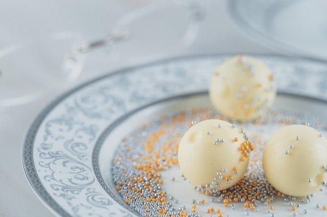 Three-white-chocolate-spheres-on-a-plate