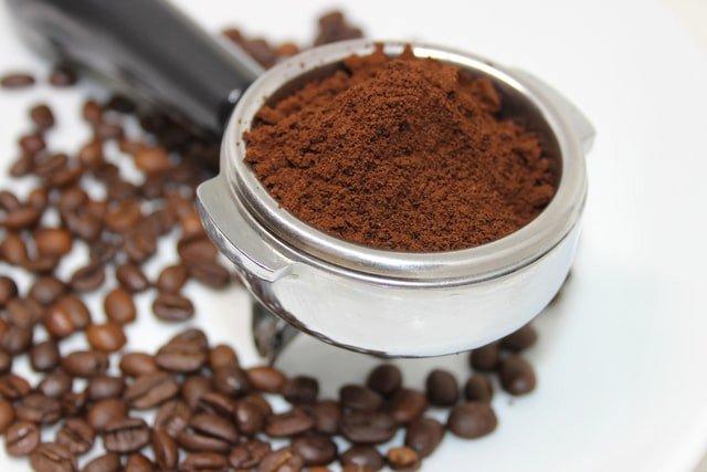 grouphead-with-coffee-beans-and-ground-coffee