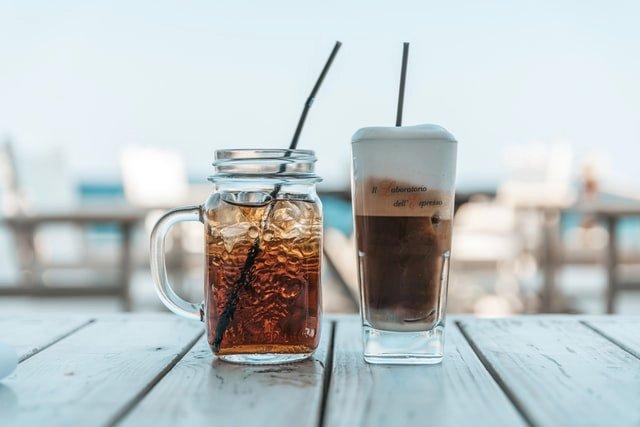 two-iced-coffee-drinks-outside-table
